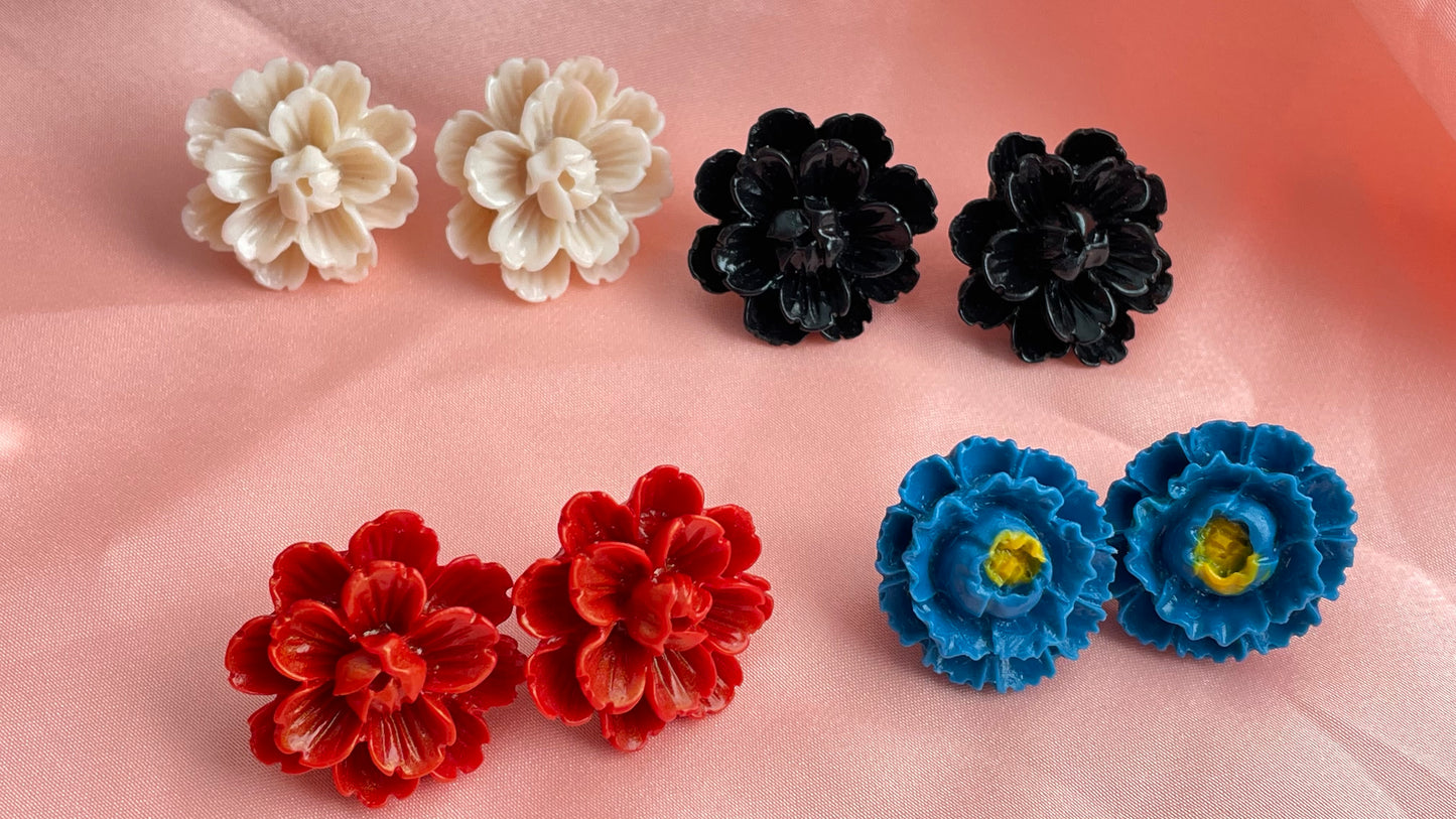 Red, blue, black, ivory flowers